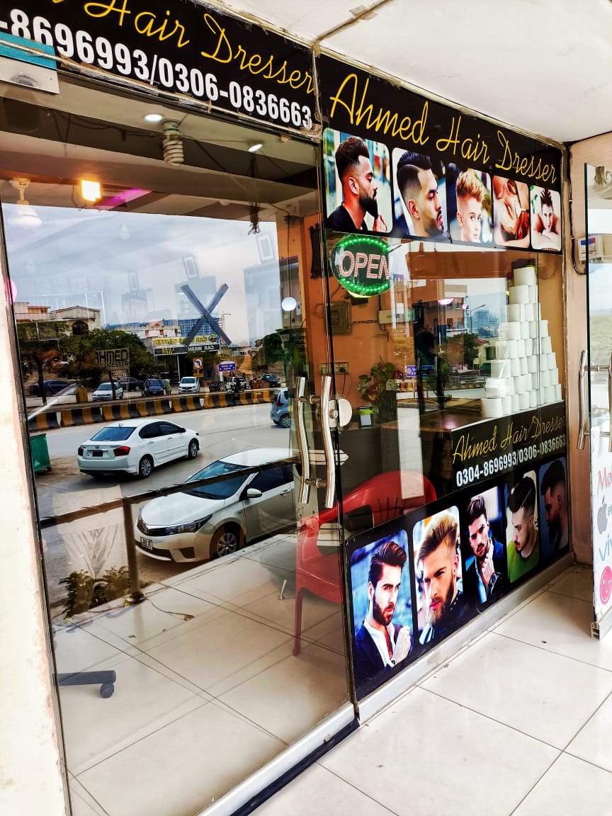 The Ahmad Hair Dresser shop door and window